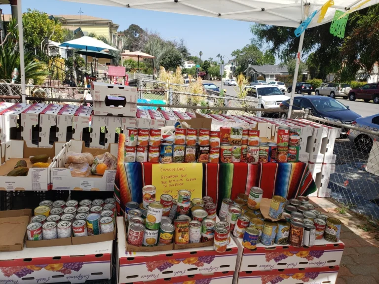 Food and supplies laid out for a community distribution