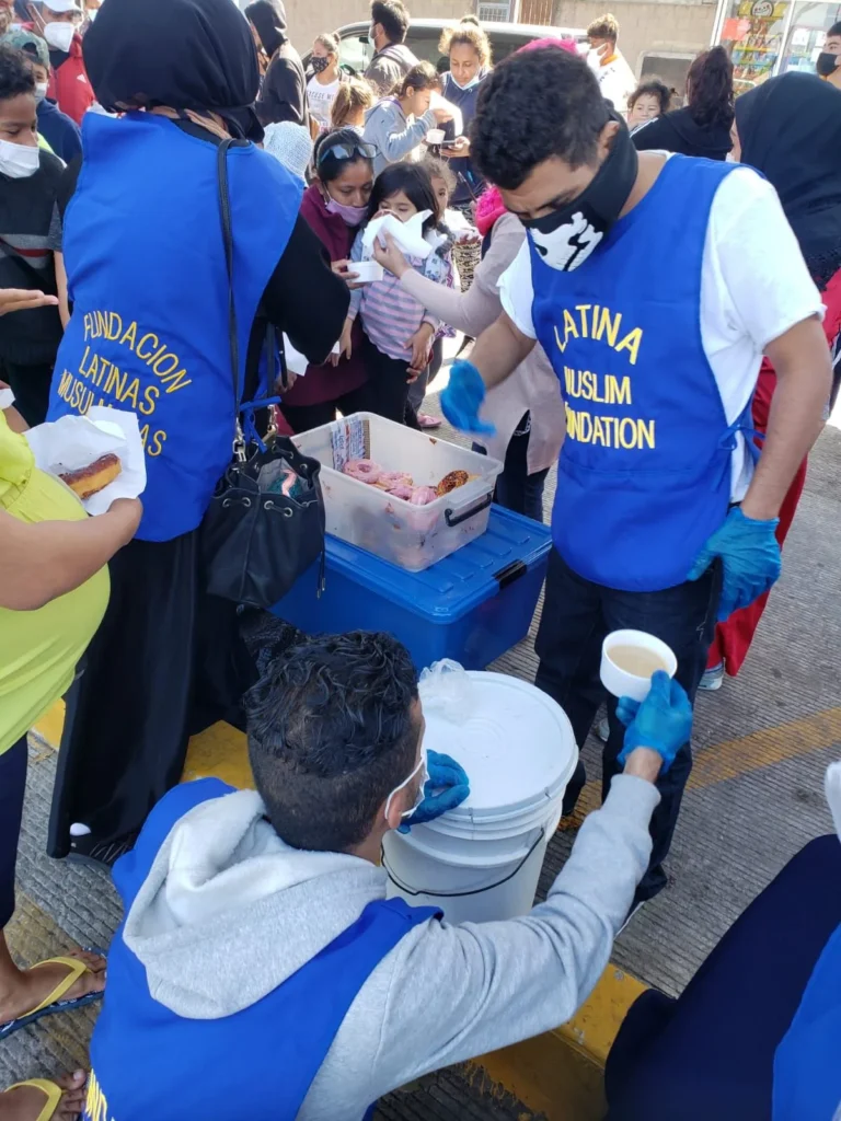 Volunteers serving food to people in need
