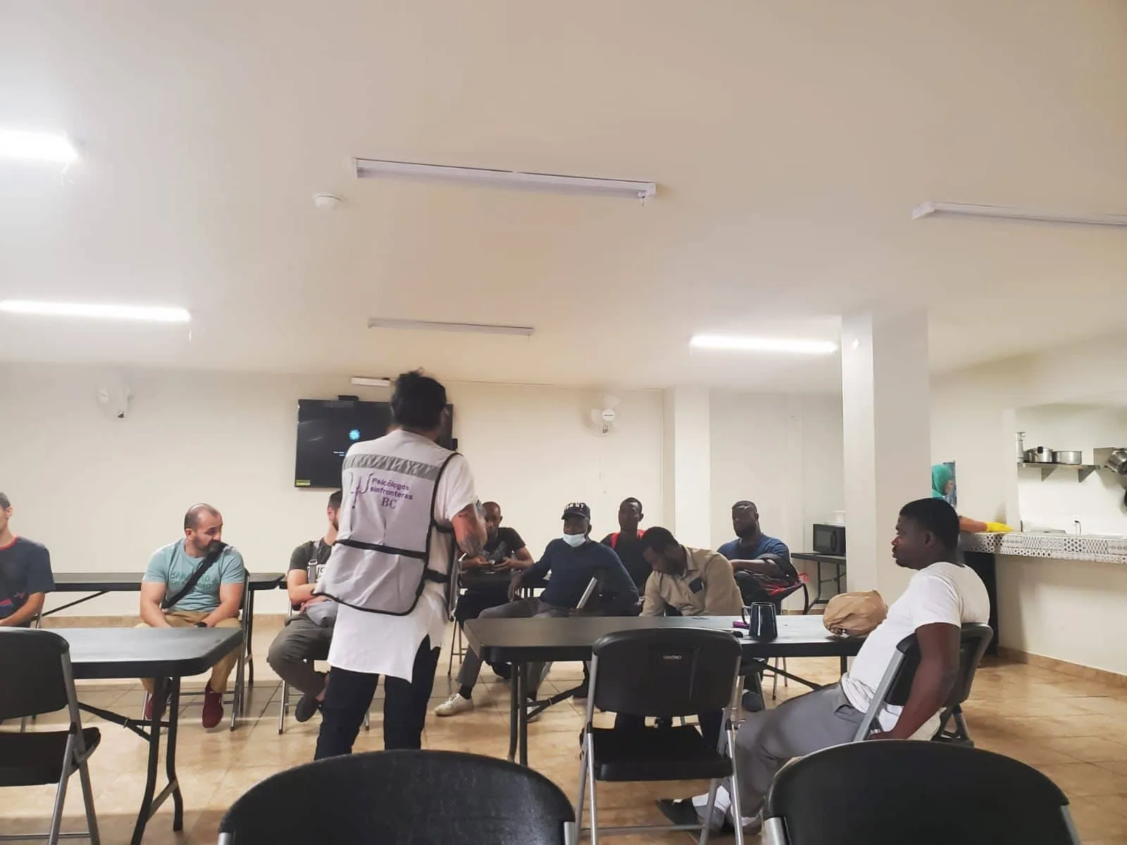Adults attending a class at the shelter